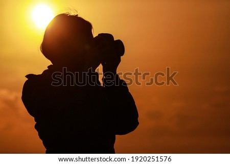 Image of a woman taking a picture 