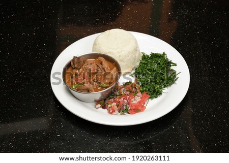Beef stew served with African ugali and kachumbari fried sukumawiki kales. Ugali Sukuma Na Nyama Kwa Supu Na Kachumbari. Kenya Dishes Meals Cuisines Dinner Delicious African Native food in Kenya East 