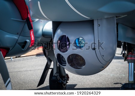 Camera sensor pod under a surveillance aircraft Royalty-Free Stock Photo #1920264329
