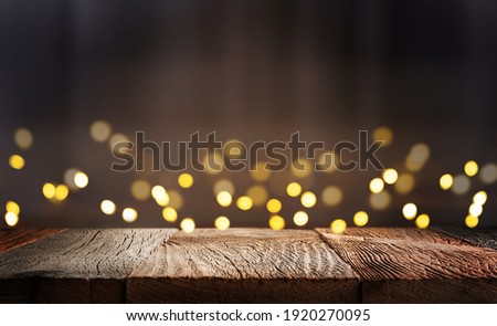 Empty wooden table top with defocused bokeh lights background. Template for product display