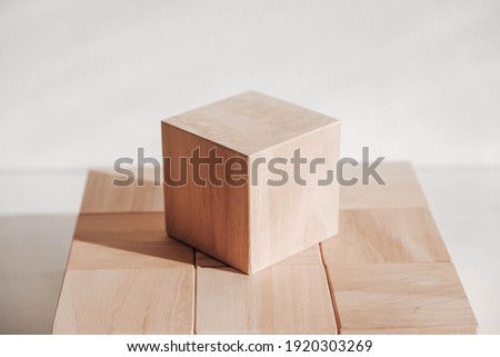 Wooden cubes from natural wood on a white background. Copy, empty space for text.