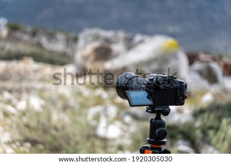 Stock photo of camera prepared to be used in the forest.