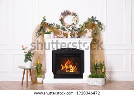 Beautiful Easter photo zone with floral decor and bunnies