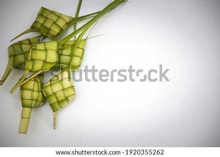 Ketupat (Rice Dumpling) On White Background. Ketupat is a natural rice casing made from young coconut leaves for cooking rice during eid Mubarak, Eid ul Fitr
