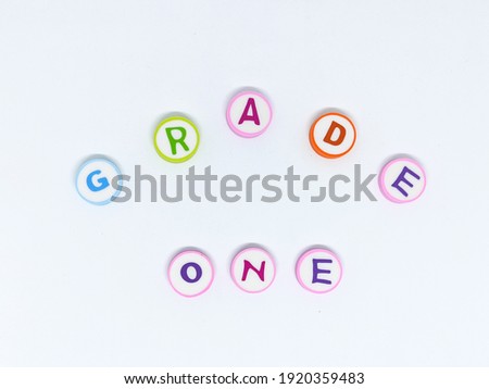 color GRADE ONE circle alphabet on white background isolated