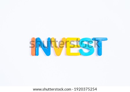 Image of word invest in colorful letter with white background