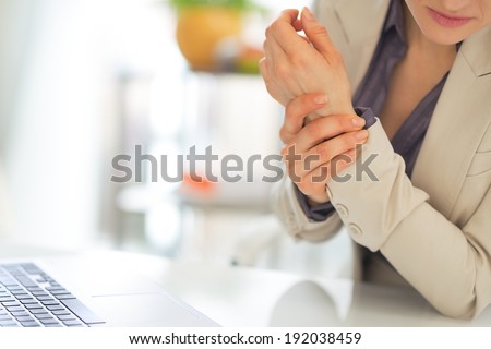 Closeup on business woman with wrist pain Royalty-Free Stock Photo #192038459