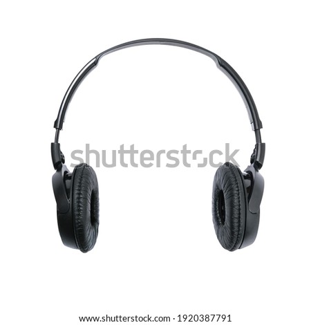 Modern black wireless headphones isolated on a white background in close-up. 