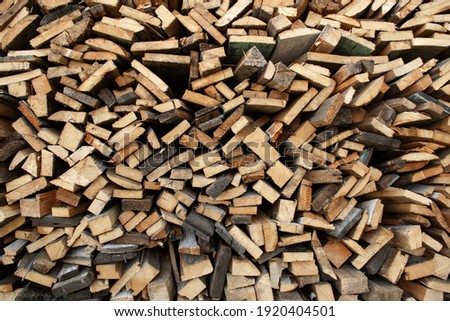 Wood Inside Sawmill. Wide banner or panorama wooden trunks. Sawmill.Natural sawn wood. The texture of the cut. Arranged boards in a sawmill. Harvesting firewood in the village. Pile of planks.firewood