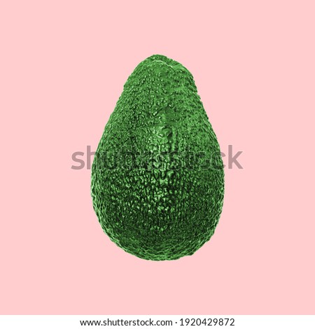 Green avocado fruit Isolated on pink background with clipping path. Pop art minimalistic design. Creative healthy fats concept