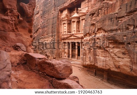 Front of Al-Khazneh (Treasury temple carved in stone wall - main attraction) in Lost city of Petra Royalty-Free Stock Photo #1920463763