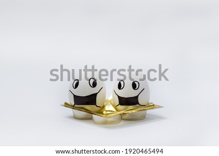 Masked eggs on a white background