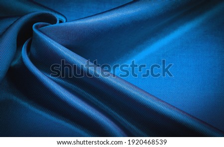 blue fabric, silk fabric, dense weaving, photo studio. Sapphire, royal blue, the play of light and shadow make this photo unique. texture, background, pattern, pattern,