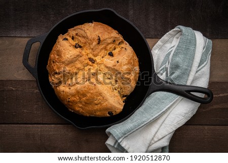 Photograph of Irish Soda Bread baked in a cast iron skillet for Saint Patrick's Day Royalty-Free Stock Photo #1920512870