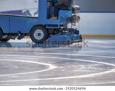 Ice resurfacer smoothing and polishing  the surface of the ice rink