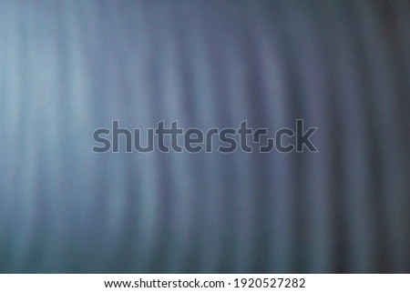 abstract colored blurred wavy background from defocused thin meshes