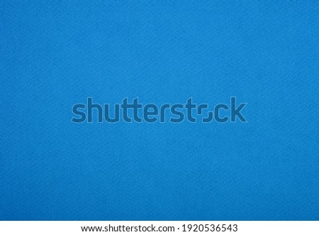 Plain blue background. Blue cardboard. Blue paper texture background. Abstract geometric flat composition. Copy spaces