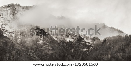 Mountains in the clouds, landscape in sepia colors