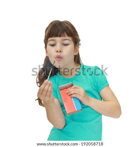 Girl blowing on match isolated on white background