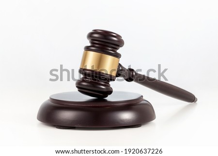 a wooden judge gavel and soundboard  on white background. Royalty-Free Stock Photo #1920637226