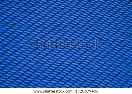 Blue Abstract Background of earthenware tiles or calls tiles consists of fish scales on the roof of temple bangkok thailand - Backdrop Resource Design