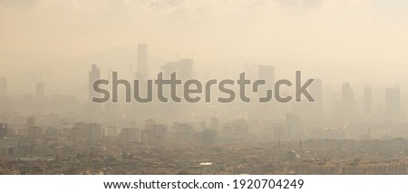 Air pollution in cities as a result of intensive urbanization and fossil fuel use causes serious damage to the world and the atmosphere. footage Royalty-Free Stock Photo #1920704249