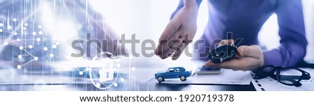 The insurance agent signs a document. Car insurance policy. Auto insurance policy. Forms registration of the contract. Royalty-Free Stock Photo #1920719378