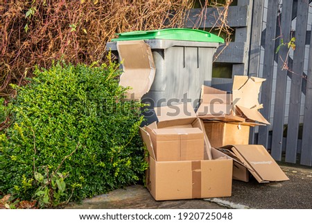 Excess cardboard packaging waste as a result of increased postal deliveries as a result of the COVID-19 pandemic Royalty-Free Stock Photo #1920725048