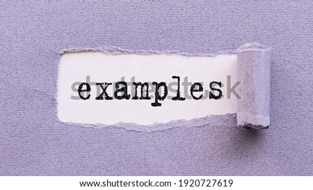 The text EXAMPLES appears on torn lilac paper against a white background. Royalty-Free Stock Photo #1920727619