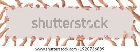 Many hands in different positions holding a poster with white isolated background. Panoramic composition