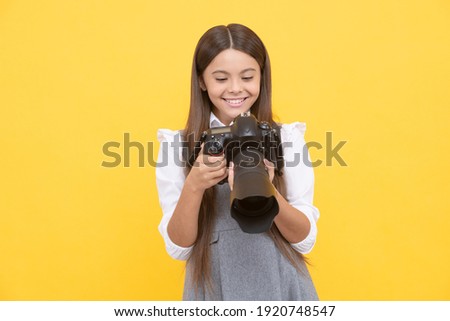 nice shot. school of photography. hobby or future career. photographer beginner with modern camera. making video. childhood. teen girl taking photo. kid use digital camera. happy child photographing. Royalty-Free Stock Photo #1920748547