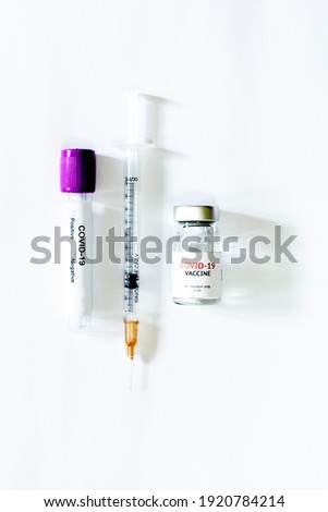 covid-19 virus, vaccine and the syringe
