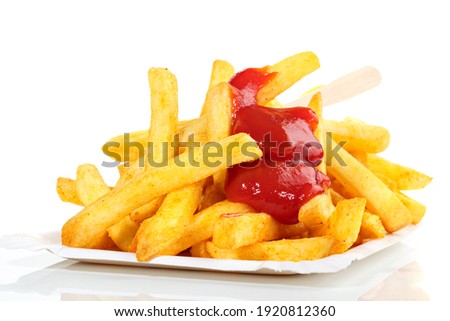 French Fries with Ketchup isolated on white Background Royalty-Free Stock Photo #1920812360