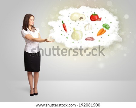 Pretty woman presenting a cloud of healthy nutritional vegetables concept