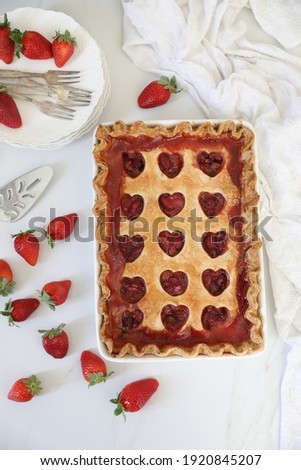 Home made Sweetheart Strawberry Rhubarb Pie for valentine's, mother's  day, birthday or other special occasion.Spring,  summer berries tart baking concept. White background,  copy space