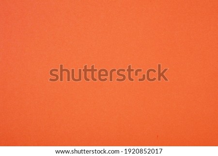 Plain orange background. Orange cardboard. Orange paper texture background. Abstract geometric flat composition. Copy spaces