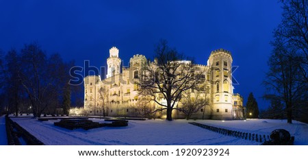 Winter view of Famous Czech castle Hluboka nad Vltavou, medieval building with beautiful park, travel outdoor european background. Night photo