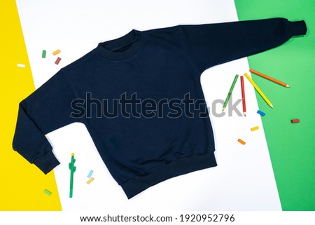 Boy's sweatshirt design with long raglan sleeves in black navy blue color, flat sketch, front and back views