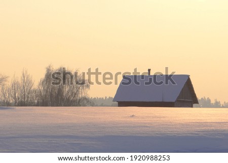 Old wooden building .Rural scene . Winter season in Europe,Lithuania 