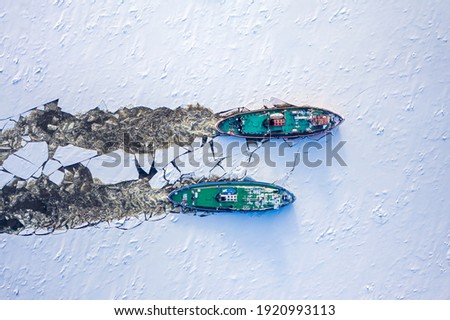 Two icebreakers breaking ice on Vistula river, Poland, 2020-02-18, aerial view Royalty-Free Stock Photo #1920993113