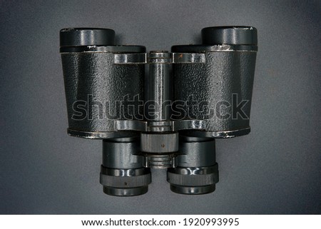 Old kepler's binoculars on a black background