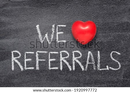 we love referrals phrase written on chalkboard with red heart symbol Royalty-Free Stock Photo #1920997772