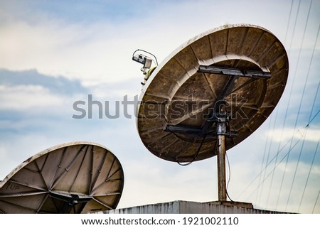 Parabolic antenna with blue sky background Royalty-Free Stock Photo #1921002110
