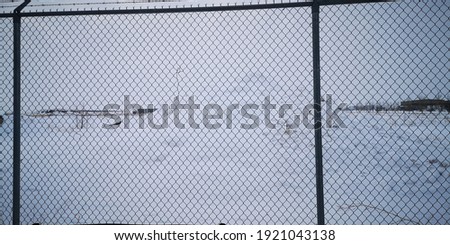 winter chain link fence close