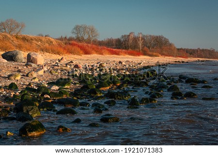 The rocky coast of the Baltic Sea at sunset