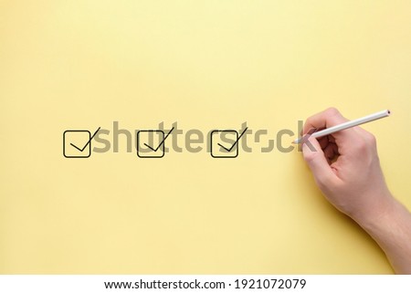 concept Person makes notes in Checkbox with pencil. Royalty-Free Stock Photo #1921072079