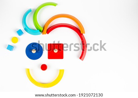 Toy smile face , cartoon smile character, minimal geometric toy clown on white background. Top view
