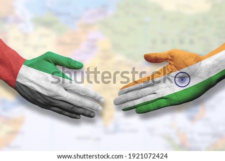 United Arab Emirates and India - Flag handshake symbolizing partnership and cooperation Royalty-Free Stock Photo #1921072424