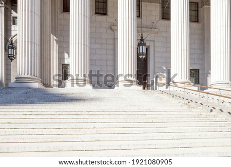 The exterior of a municipal or government building or courthouse. Royalty-Free Stock Photo #1921080905