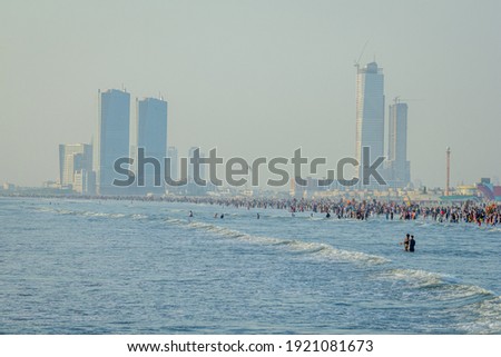 A beautiful picture of seaview wave with buildings karachi sindh. Royalty-Free Stock Photo #1921081673
